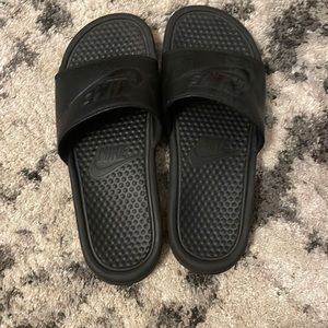Size 9: Nike Slides, Used very few times still pretty much brand new.
